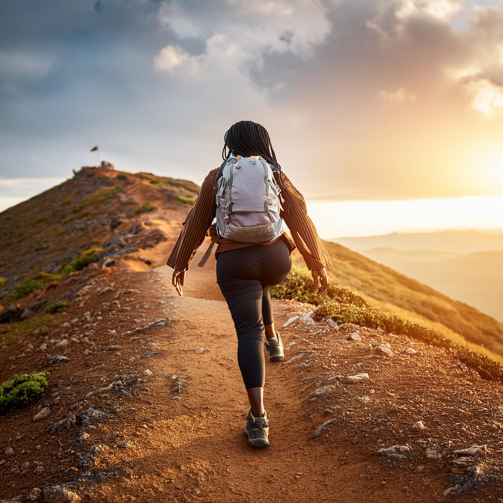 A woman climbing a hill